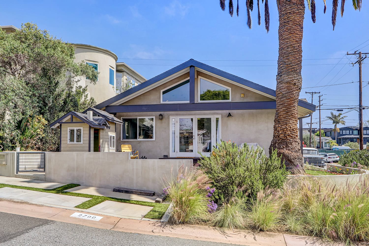 Front exterior of 2700 Elm Avenue, Manhattan Beach, a three bedroom house on a corner lot in the Tree Section, sold May 2026