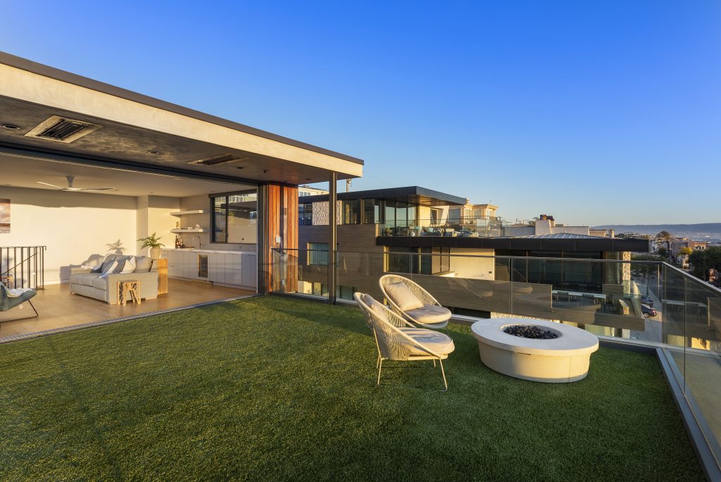Rear deck with a fire pit, lawn and covered patio looking out to an ocean view, Hermosa Beach