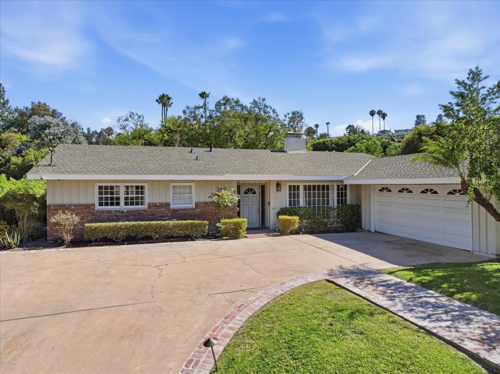 Single-story ranch home with a circular drive and mature trees near Silver Spur Road in Rancho Palos Verdes