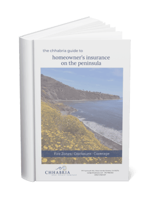 Standing book mockup of The Chhabria Guide to Insurance and a Peninsula Purchase, showing the final cover with wildflowers on a Palos Verdes bluff and a navy band reading Fire Zones, Disclosure, Coverage.